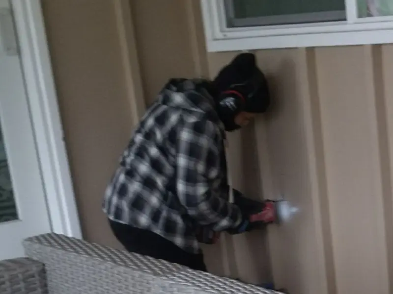 Professional electrician installing an exterior outlet in Seaside
